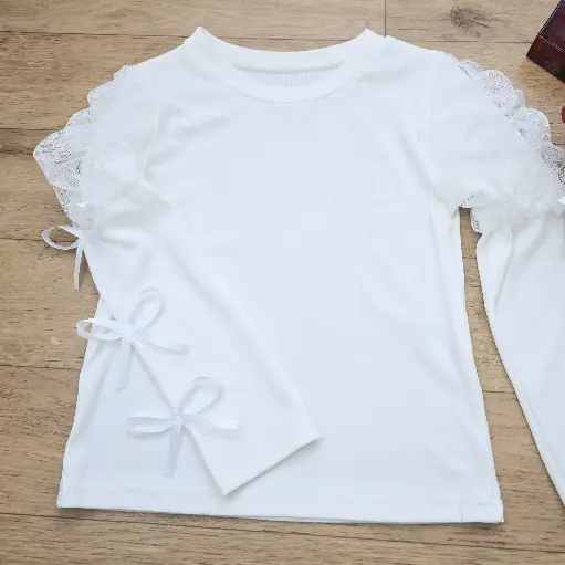 Blouse blanche fille avec manches en tulle et nœuds